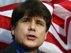 Former Illinois Governor Rod Blagojevich makes a statement to reporters outside his Chicago home one day before reporting to federal prison in Colorado to serve a 14-year sentence for corruption, in this March 14, 2012 file photo. REUTERS/Jeff Haynes